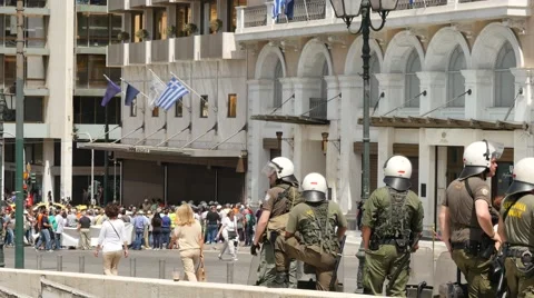 Police forces controlling situation with protesters in Athens closeup Stock Footage 63905102