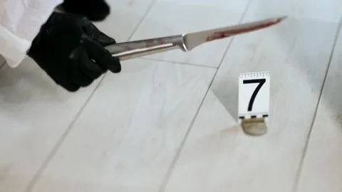A police forensic examines the evidence. Stock Footage 316727336
