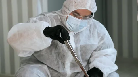 A police forensic examines the evidence. Stock Footage 316727733