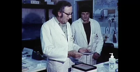 Police Forensic Laboratory Work: Men at Work in Australia, 1982 Stock Footage 261123058