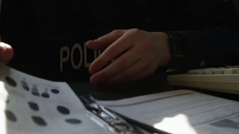 Police going over fingerprints in database Stock Footage 72971869