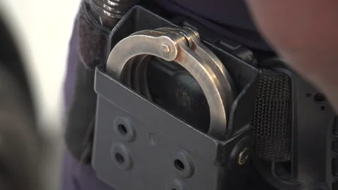 Police handcuffs Stock Footage