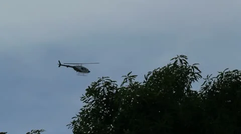Police helicopter at a distance Stock Footage 12096830