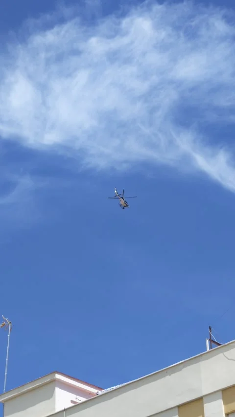 A police helicopter hovering motionless during a security surveillance operation Stock-Footage 333702072