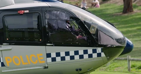 Police helicopter lifting off to fly out on police operation. Stock Footage 88451736