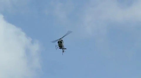 Police helicopter passes overhead Stock Footage 12117331