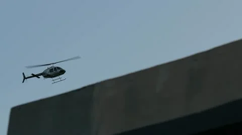Police helicopter passing by Stock Footage 11960176