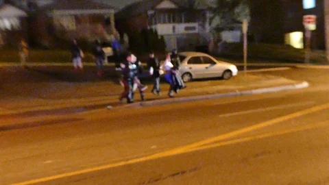 Police helping shot man while swearing at cameraman - 24fps 1080p Stock Footage 91561967