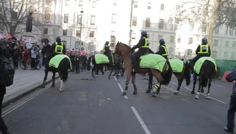 Police on Horseback move back Stock Footage 3936972