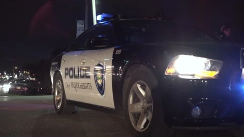 Police of Huber Heights sitting at intersection with lights on 4k Stock Footage 91997902
