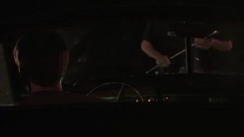 Police interaction in front of a car at night Stock Footage 300114477