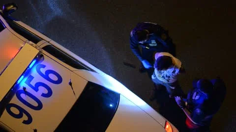 Police law enforcement Arrest suspect taking crime suspect to jail at night time Stock Footage