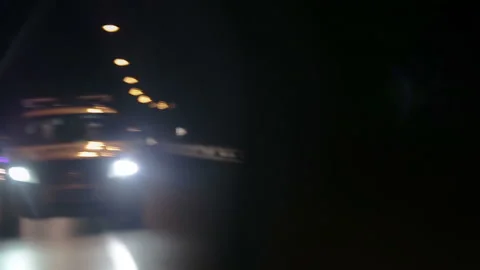 Police lights flashing in side view mirror of car Video stock 99059548