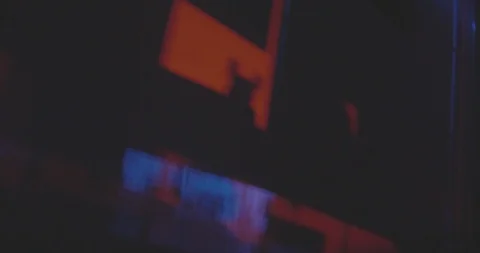 Police lights flicker in a unique pattern on the wall inside a home at Stock Footage 97070100