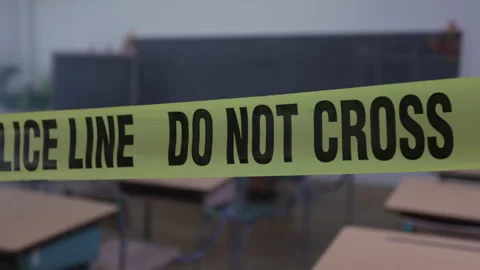 Police line do not cross close up in school room Stock Footage 315521696