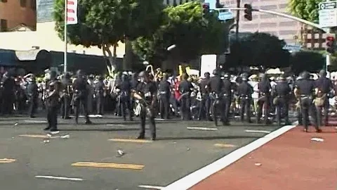 Police line up at protest. DNC 2000. Video stock 94159127
