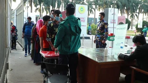 Police man are checking temperature for corona virus and giving hand sanitizer . Stock Footage 146773164