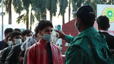 Police man are checking temperature for corona virus , covid 19  . Stock Footage 146773481