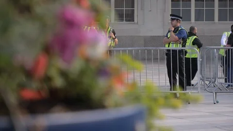 Police marching purposefully outside cardiff central station Stock Footage 114411994
