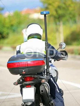 Police motorbike with blue siren Stock Photos