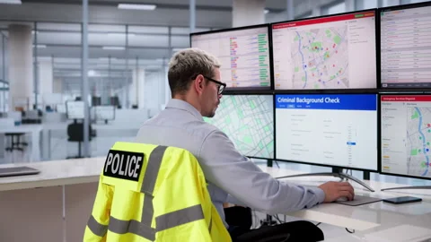 Police Officer Calmly Using Desktop Computer Stock Footage 333398029