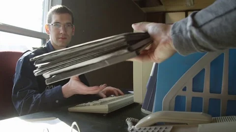 Police officer   frustrated by overload of work on desk Stock Footage 72972000