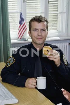 Police officer having a coffee break Stock Photos