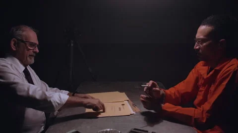 Police officer interrogating a man with documents Vídeo Stock 347831929