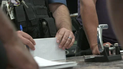 Police Officer Putting Down Notepad at Meeting Close Up 4K Stock Footage 145956885