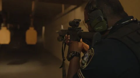 Police Officer Shooting a Rifle in a Sho... | Stock Video | Pond5