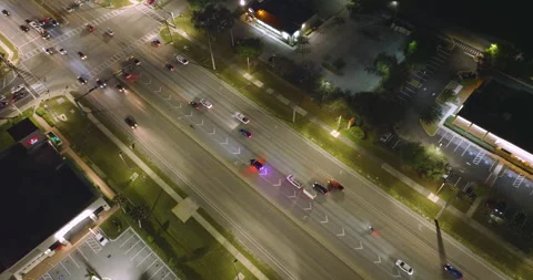 Police officer stop a speeding driver on American street at night. Emergency Stock Footage 325404712