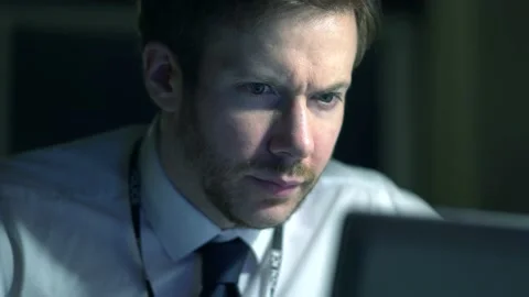 Police Officer Trying To Solve Case With Computer At Station Stock Footage 131432473