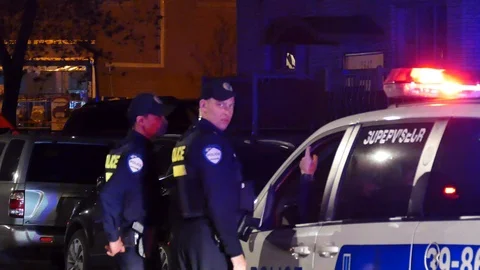 Police officers chatting at command post Video stock 114687714