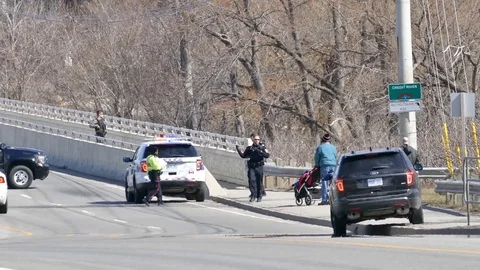 Police officers helping dad with stroller to cross - 24fps 1080p Stock Footage 91567424