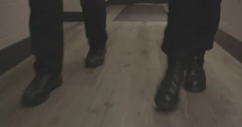 Police Partners Marching down Hallway Tracking Feet 4K 스톡 동영상 146422489