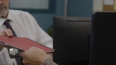 Police passing documents in precinct desks Stock Footage 283442717