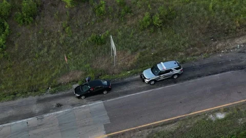 Police pulls over driver on the highway drone video Stock Footage 246706301