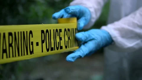 Police Put Up Crime Scene Barricade Tape In The Woods, Warning Do Not Enter Stock Footage
