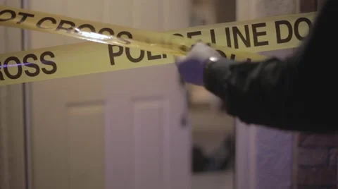 Police Putting Up Caution Tape Stock Footage 64217091