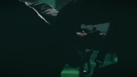 Police putting on handcuffs on a hacker Stock Footage 170186399