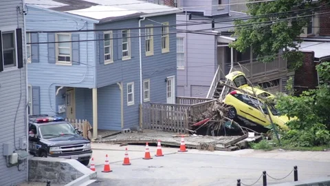 Police road block at the wreckage of car after flood damage and disaster Stock Footage 70537853