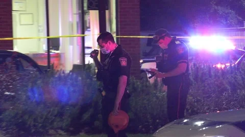 Police at scene of multiple shooting murder in city Stock-Footage 154880966