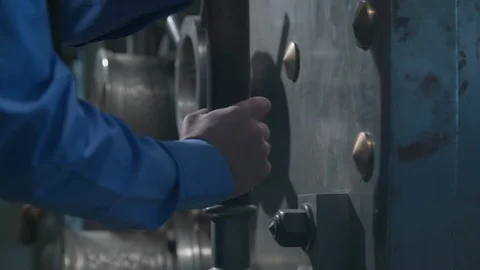 Police Security Guard - hands in uniform close large bank vault door. Stock Footage 88471395