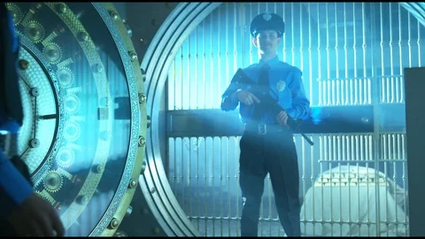 Police Security Guard - stands with machine gun, guards bank vault. Stock Footage 86277532