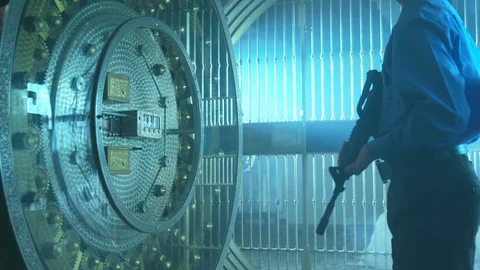 Police Security Guard - stands with machine gun, guards bank vault. Stock Footage 88471528