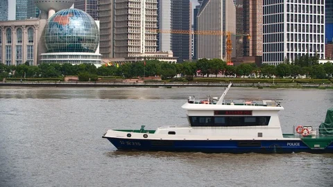 Police ship floating on the river in Shanghai by day Stock Footage 99981589