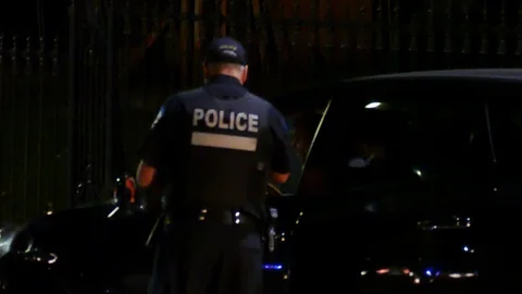 Police speaking with driver implicated in accident Stock Footage 119903543