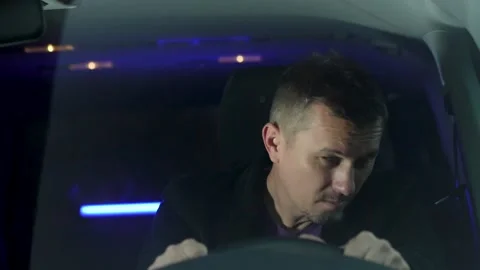 Police stopped drunk driver, close-up. Drunk man drinking beer while drivin.. Stock Footage 286128059