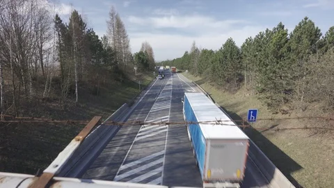 Police stopped traffic causing jam on a flat road in the middle of nature Stock Footage 126569661