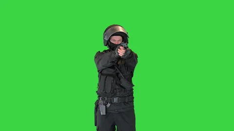 Police tactical unit aiming with a hand gun on a Green Screen, Chroma Key. Stock-Footage 148337266